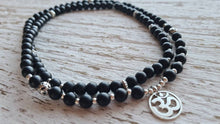 Load image into Gallery viewer, Matte Onyx Om Mala  stretch mala with artisan om charm, black onyx wrap bracelet.