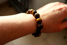 Load image into Gallery viewer, Tiger eye bracelet. High quality 12mm faceted beads.Unisex bracelet. Gift for her and him.
