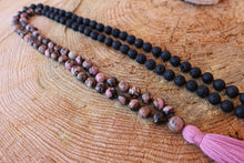 Load image into Gallery viewer, Pink Black Rhodonite and Lava Stone Mala. Hand knotted 108 beads Mala, Handmade Cotton Tassel. Vegan necklace .
