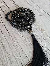Load image into Gallery viewer, Astrophyllite Tourmaline Silver plated Lava Stone Mala, Hand knotted 108 Men Prayer Beads, Handmade Tassel necklace for Him, Vegan necklace.
