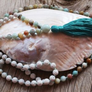 108 beads lovingly hand-knotted mala. Made of white Lava stone, Amazonite and Love.